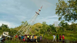 A rainbow appeared in the sky and seemed to help the villagers lift the tower into place